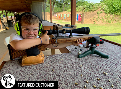 Jame's teaching his grandson at the range.